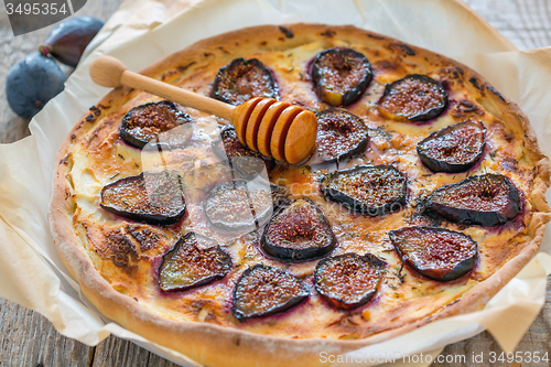 Image of Pizza with figs, honey and thyme.
