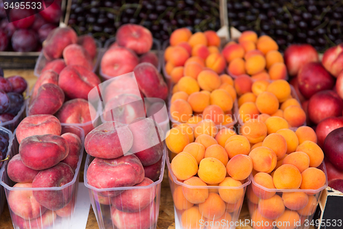 Image of close up of peaches and apricots at street market