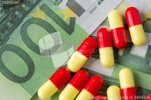 Image of medical pills or drugs and euro cash money