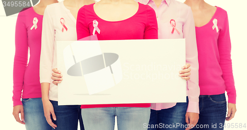 Image of close up of women with cancer awareness ribbons