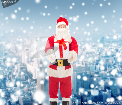 Image of man in costume of santa claus with gift box