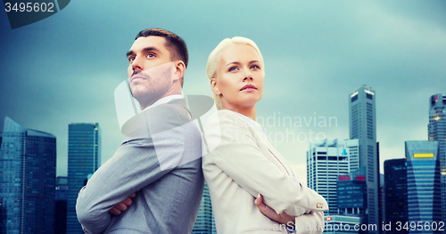 Image of businessman and businesswoman outdoors