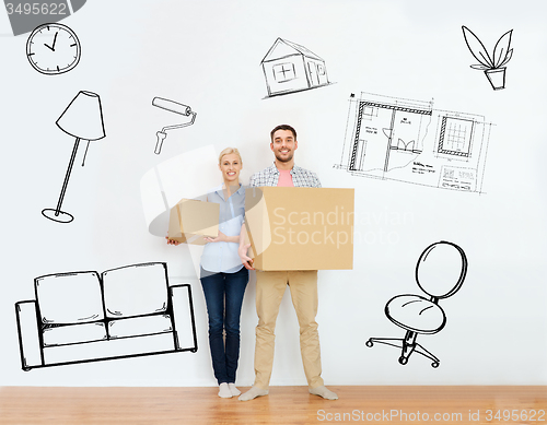 Image of couple with cardboard boxes moving to new home