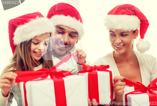 Image of happy family sitting on couch at home