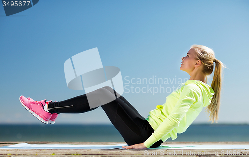Image of woman doing sports outdoors