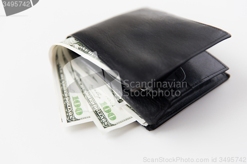 Image of close up of dollar money in black leather wallet