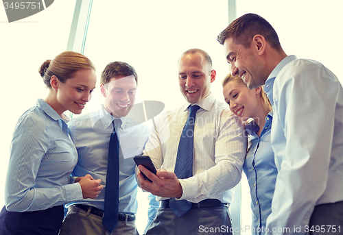 Image of happy businesspeople with smartphone