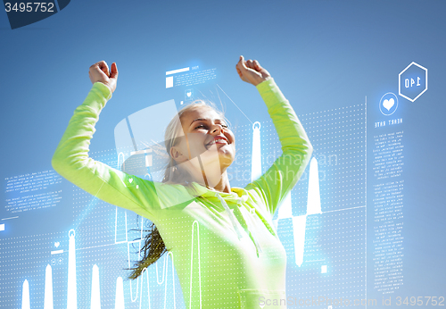 Image of woman runner celebrating victory