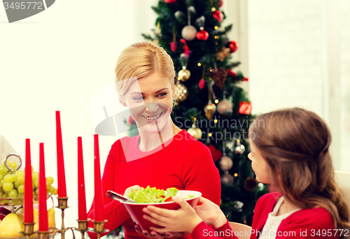 Image of smiling family having holiday dinner at home