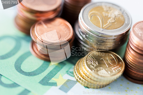 Image of close up of euro paper money and coins on table