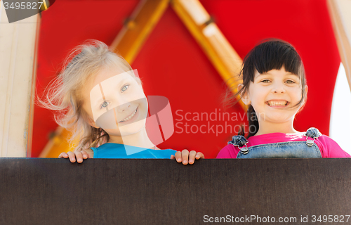 Image of group of happy little girls on children playground