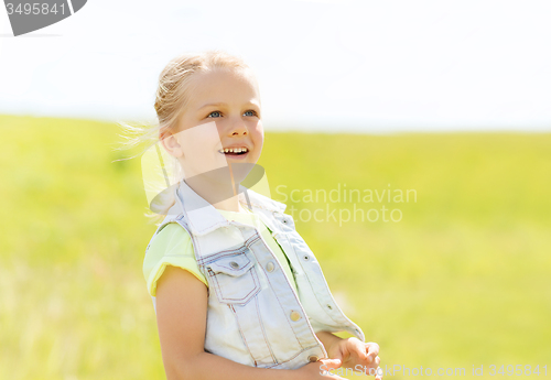 Image of happy little girl outdoors at summer