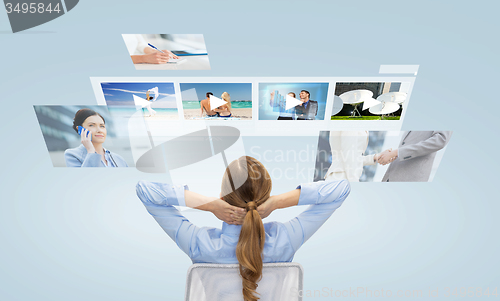 Image of businesswoman watching video media files