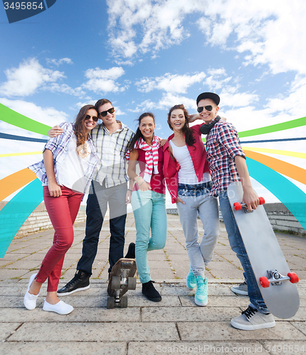 Image of teenagers with skates outside