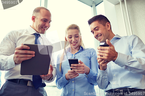 Image of business people with tablet pc and smartphones