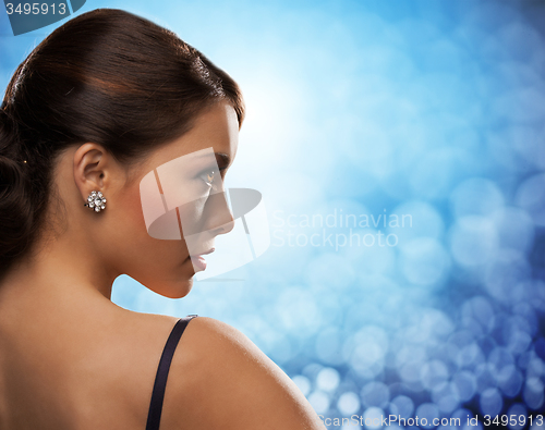 Image of woman with diamond earrings