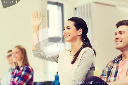 Image of group of smiling students in lecture hall