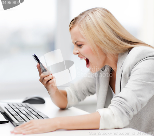 Image of angry woman with phone