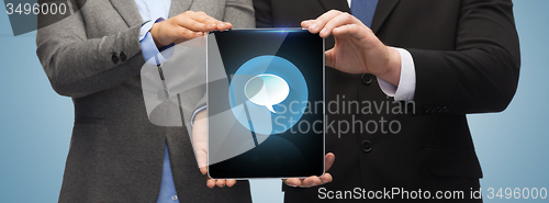 Image of businessman and businesswoman with tablet pc