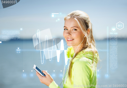 Image of woman listening to music outdoors