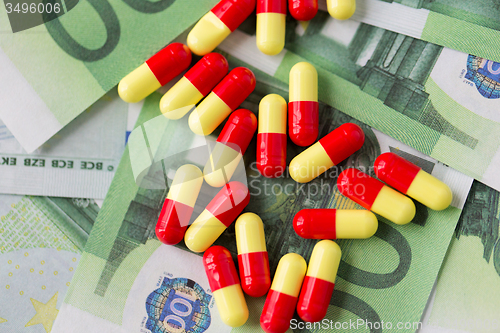 Image of medical pills or drugs and euro cash money