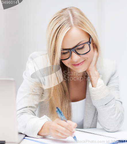 Image of businesswoman with documents