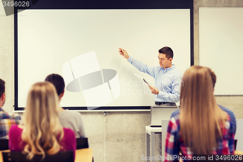 Image of group of students and teacher with notepad