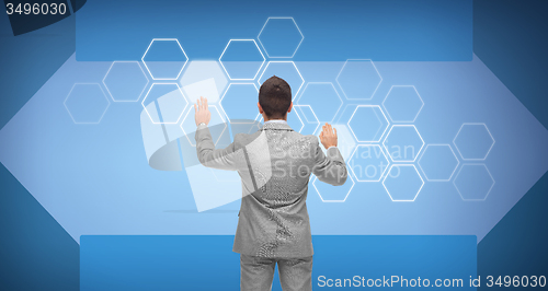Image of businessman in suit working with virtual screen