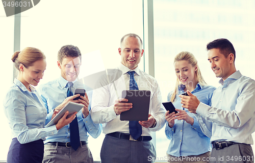 Image of business people with tablet pc and smartphones