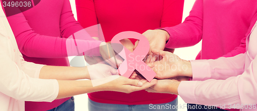 Image of close up of women with cancer awareness ribbons