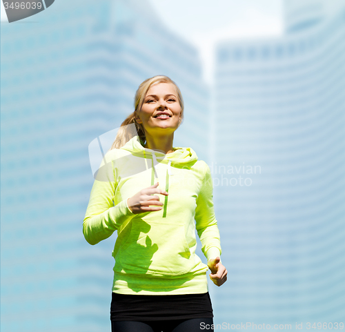 Image of woman jogging outdoors