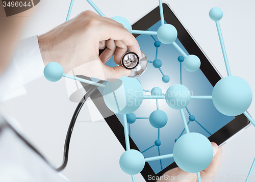 Image of close up of doctor with stethoscope and tablet pc