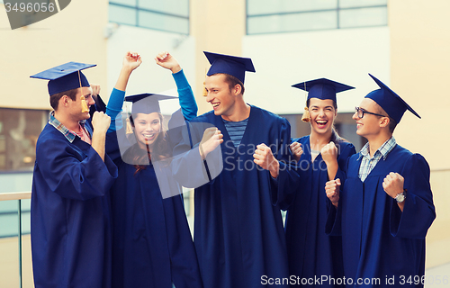 Image of group of smiling students in mortarboards