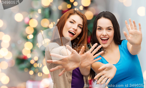 Image of smiling teenage girls having fun