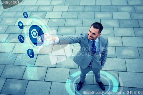 Image of young smiling businessman outdoors from top