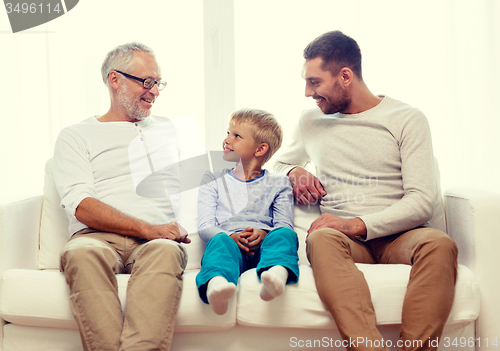 Image of smiling family at home