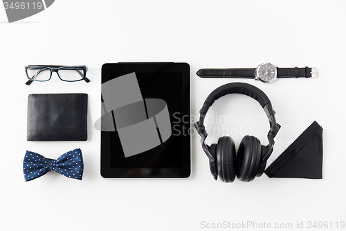 Image of tablet pc, headphones with hipster personal stuff