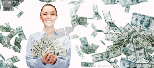 Image of smiling businesswoman with dollar cash money