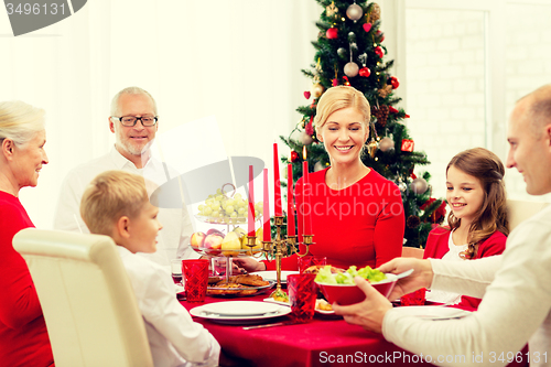 Image of smiling family having holiday dinner at home