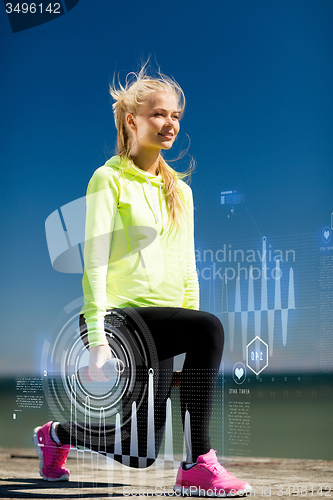 Image of sporty woman with light dumbbells outdoors