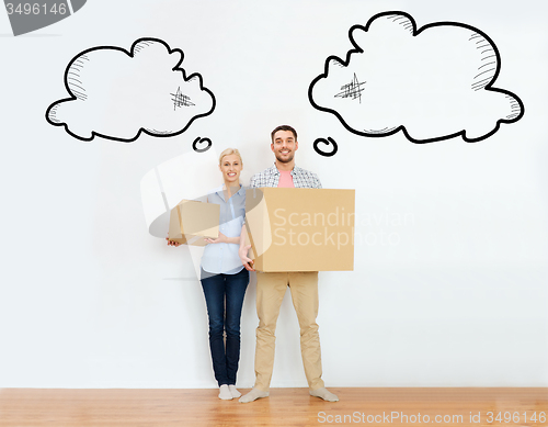 Image of couple with cardboard boxes moving to new home