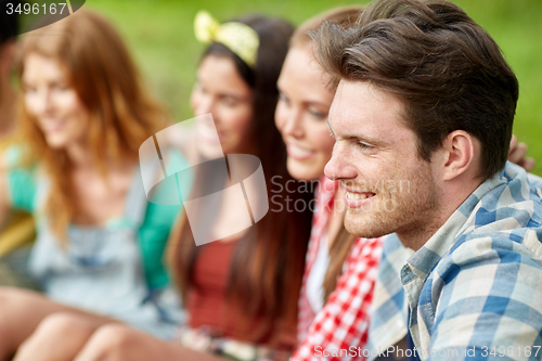 Image of group of smiling friends outdoors