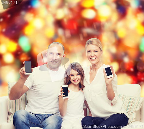 Image of happy family with smartphones