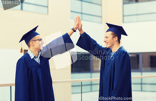 Image of smiling students in mortarboards