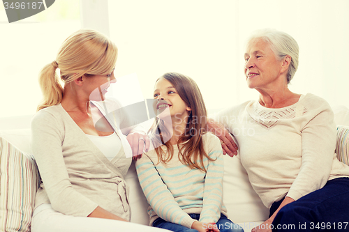 Image of smiling family at home