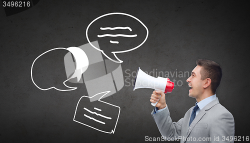 Image of happy businessman in suit speaking to megaphone