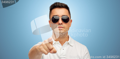 Image of man in sunglasses pointing finger on you