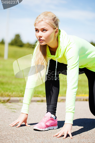 Image of woman doing running outdoors