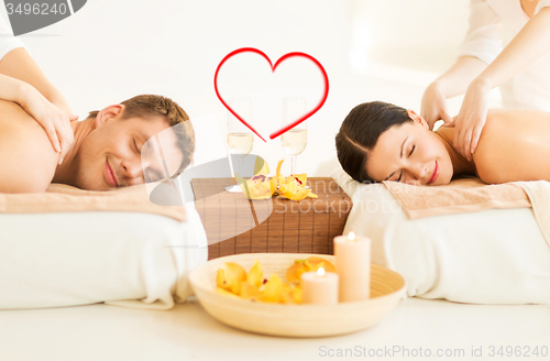 Image of couple getting massage in spa salon