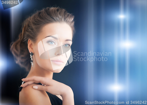 Image of woman with diamond earrings